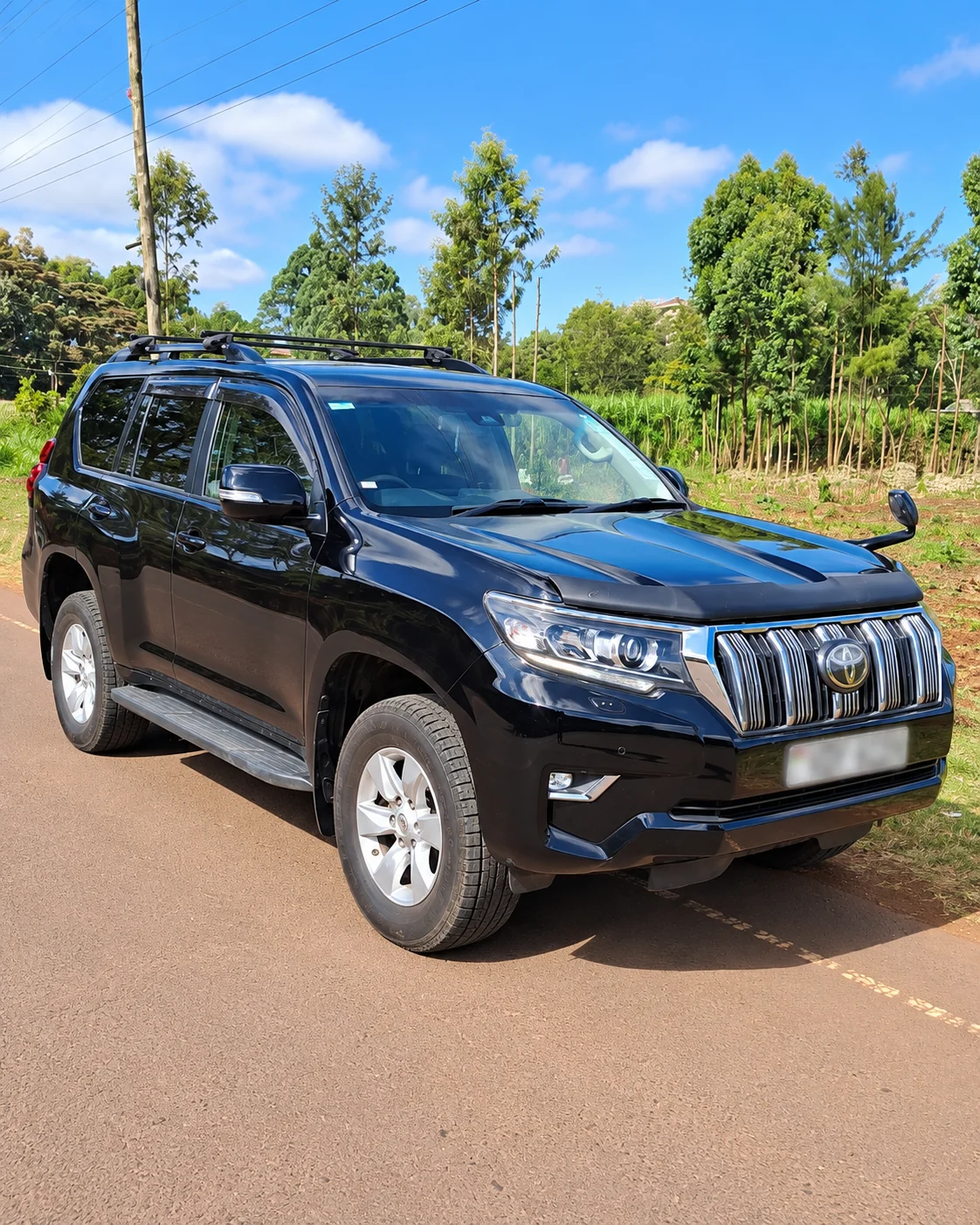 Black Toyota Land Cruiser Prado available for executive chauffeur hire by Shanjoy Tours